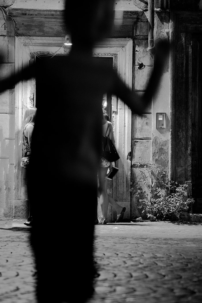 Playing in the shadows in fornt of the gelateria