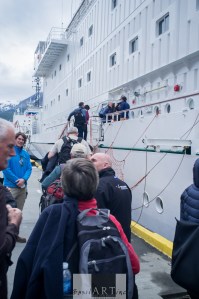 Welcomed by assistant expedition leader Nate Small at the gangway